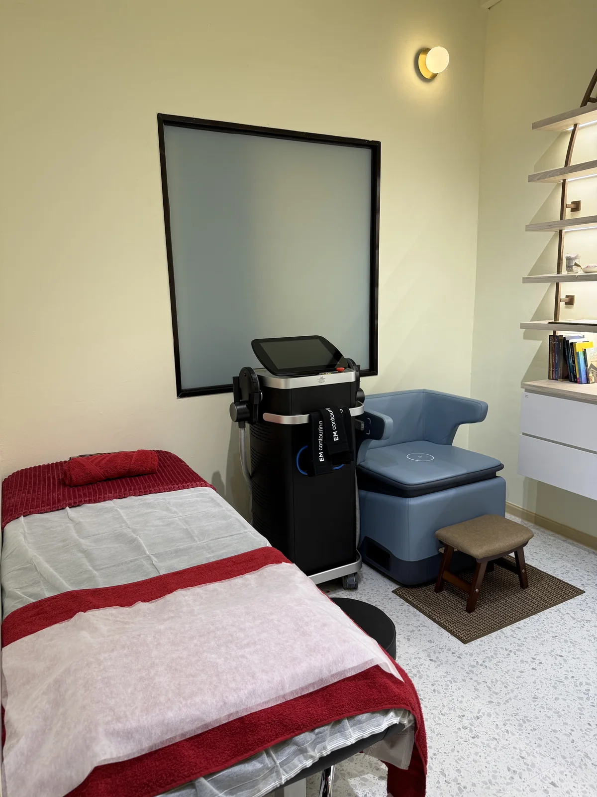 Treatment room with the therapy bed and pelvic floor chair
