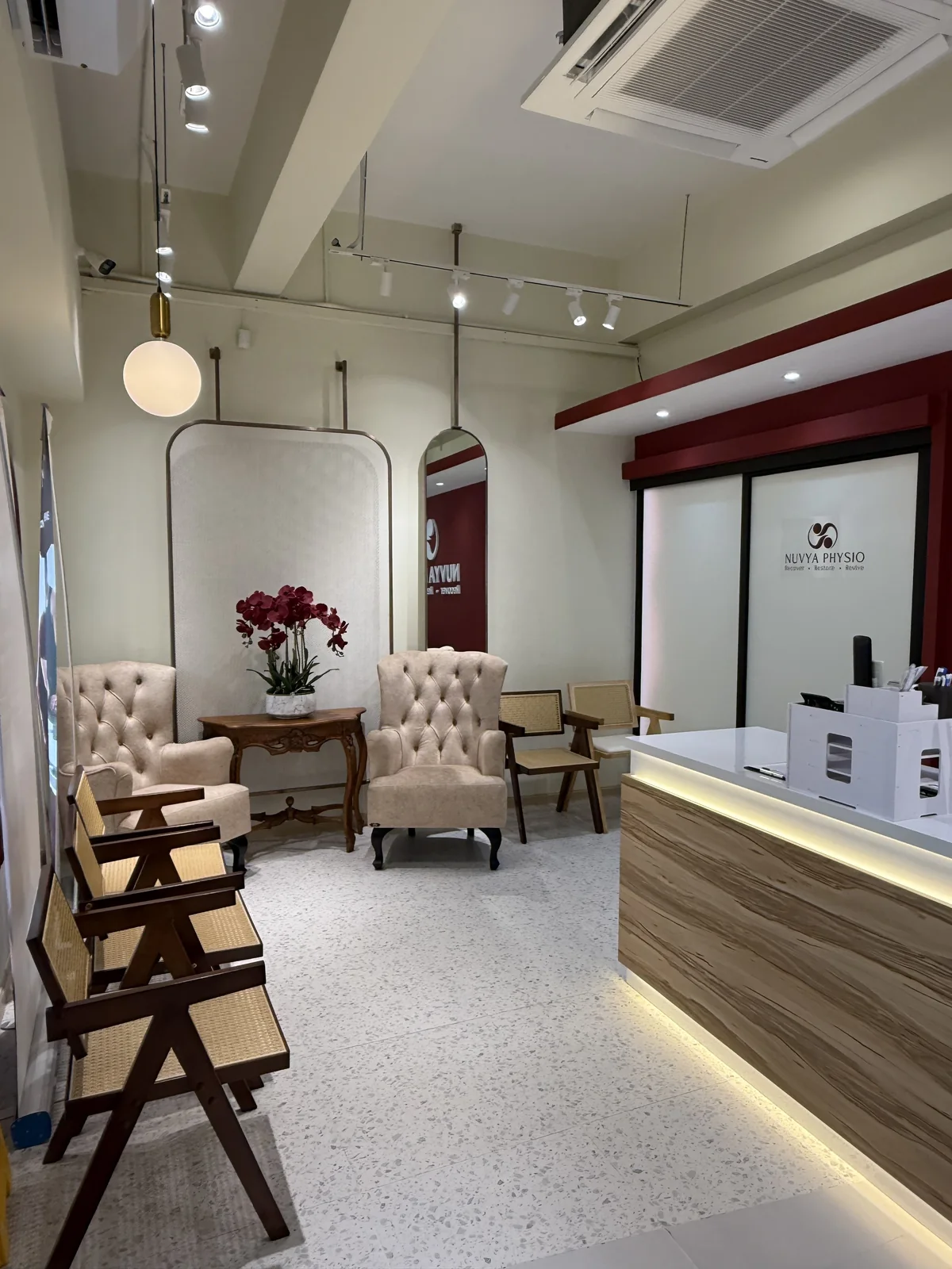 Reception lounge with armchairs and the welcome desk